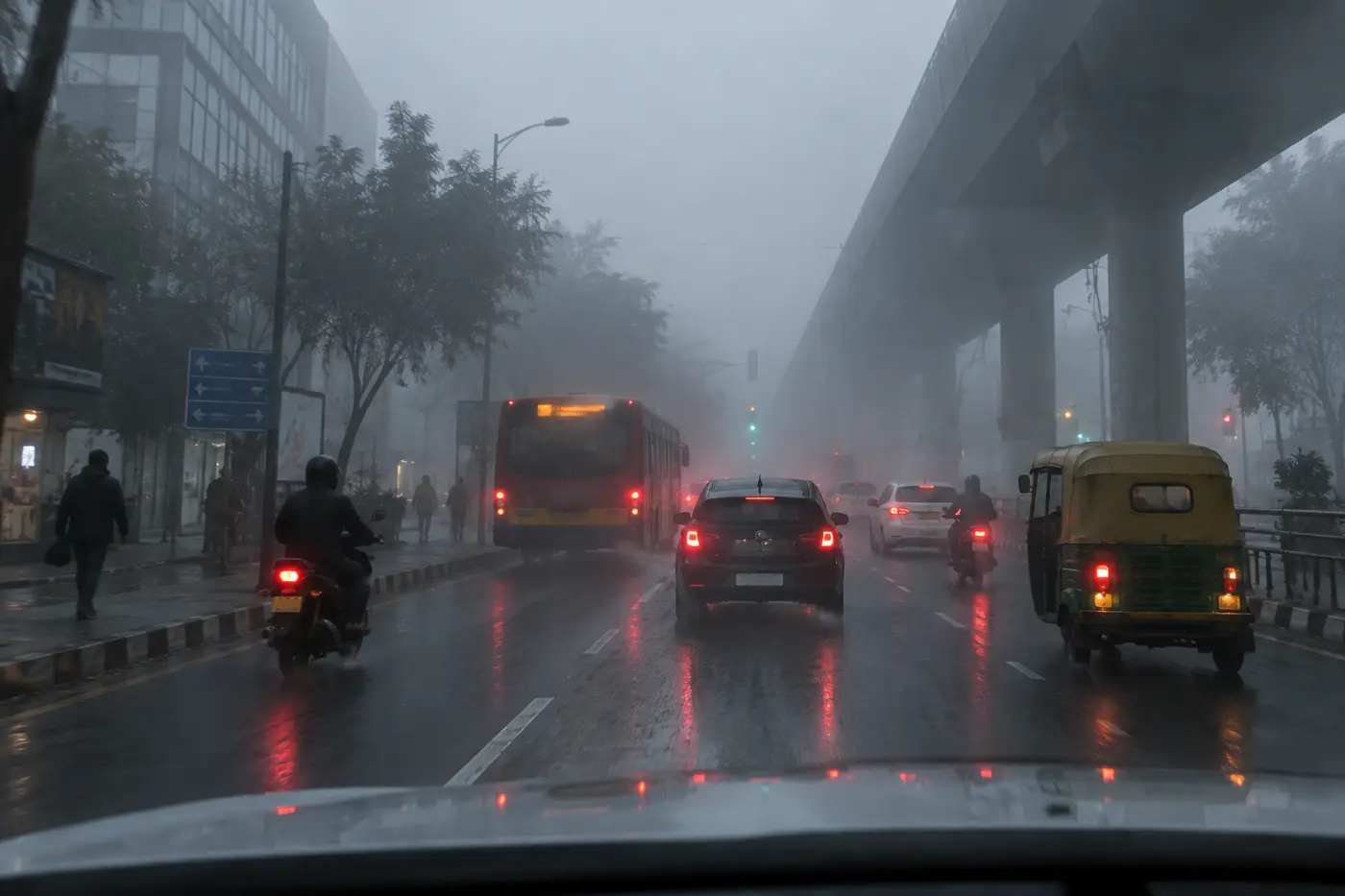 Dense city street in fog, seen from a vehicle camera
